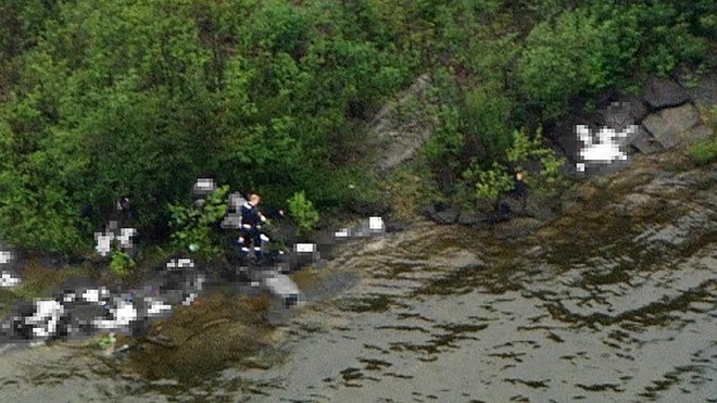 Norway shooter walking along water